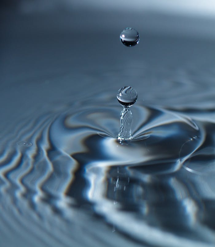 Crafting Captivating Headlines: Your awesome post title goes here High-speed capture of a water drop creating mesmerizing ripples.